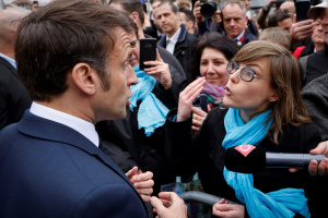 Read more about the article Macron booed by angry French after signing pensions reform